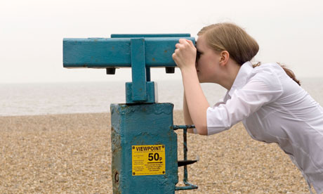 Girl Looking Through Seaside Binoculars