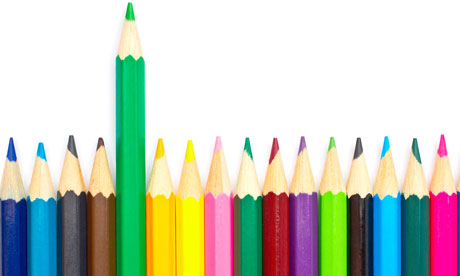 Assortment of coloured pencils with shadow on white background