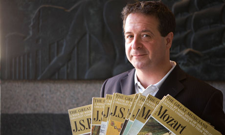 Mark Thomas pictured holding some of his father's records.