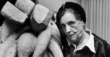 Louise Bourgeois with one of her sculptures, Baroque (1970)