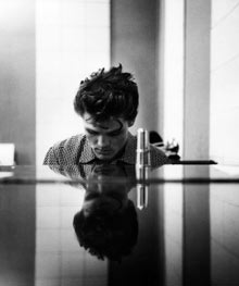 Chet Baker at a piano, photographed by William Claxton