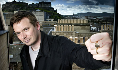 Ian Rankin on a balcony over looking Edinburgh Castle