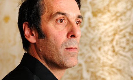 Richard Wright, 2009 Turner prize winner, in front of his gold-leaf wall paintings at Tate Britain