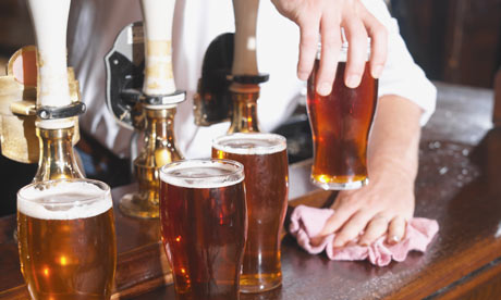 Pints of beer on a bar in a Pints of beer on a bar in a