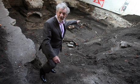 Ian McKellen stands on the site of the Theatre in Shoreditch