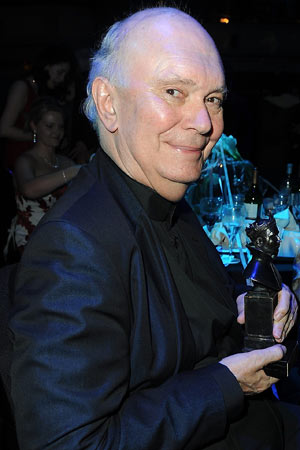 Sir Alan Ayckbourn poses with his special award at the Laurence Olivier awards
