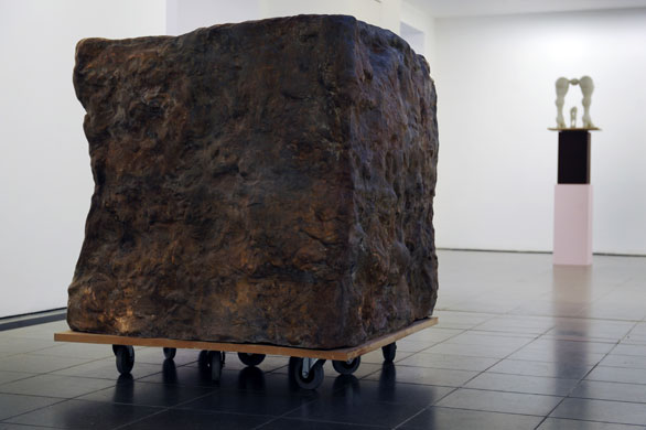 Rebecca Warren: Rebecca Warren: Cube (2003) - bronze, MDF and wheels.