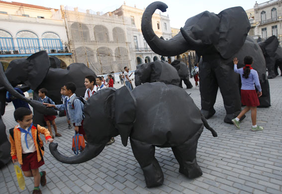Week in art: School children walk among metal elephants on a square in Old Havana