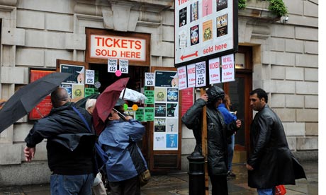 Tourists queue for theatre tickets in Covent Garden