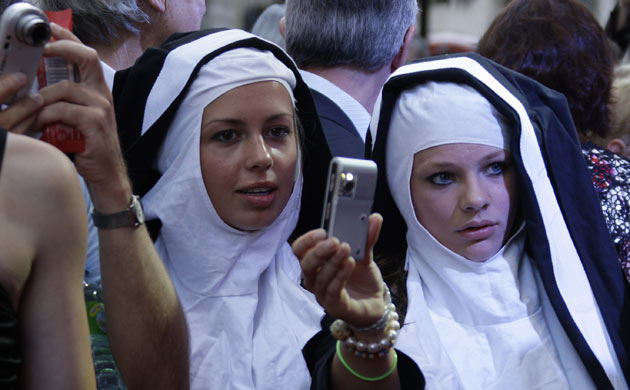 Theatregoers dressed as nuns spot celebrities at the opening night of Sister Act at the Palladium