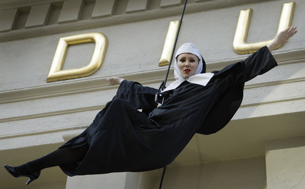 An abseiling nun at the opening night of Sister Act at the Palladium