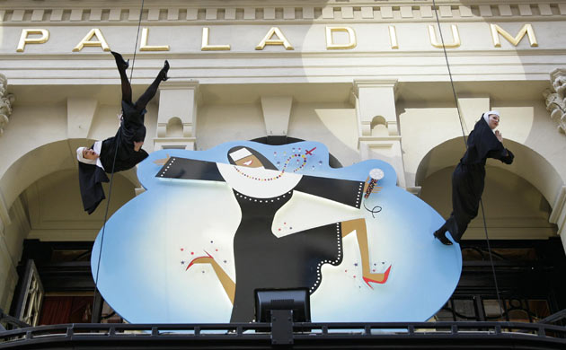 Nuns abseil outside the Palladium at the press night of Sister Act
