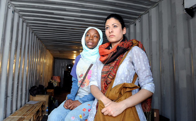 Mercy Ojelade (Asha) and Amber Agar (Mariam) in The Container outside the Young Vic