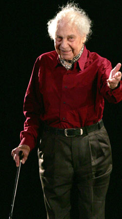 Merce Cunningham salutes the crowd on stage after a show in Paris in 2005