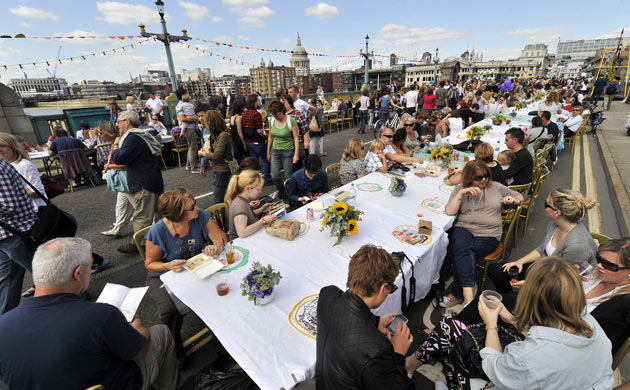 Festivalgoers enjoy a feast on Southwark Bridge as part of the Mayor's Thames festival