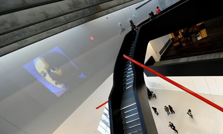 Visitors walk past an instalation in the Maxxi, Zaha Hadid's Roman museum of contemporary art 