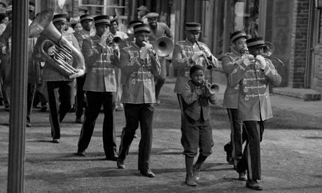 Anthony ­Coleman (third from right) as the young Louis Armstrong in Louis.