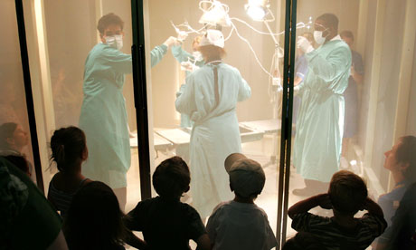 Children watch a performance of Hospitalworks