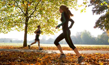 Young woman and man running.