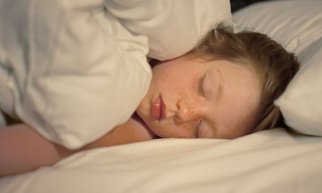 Little girl sleeping in bed