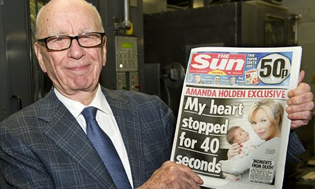 Rupert Murdoch with first issue of the sun on sunday