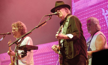 Neil Young, centre, with Frank Sampedro,and Billy Talbot on stage at Metro Radio Arena, 