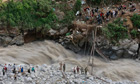 Soldiers repair bridge over River Alaknanda Uttarakhand