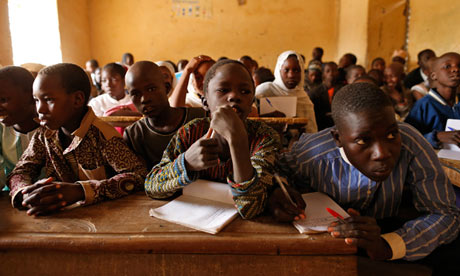 Children listen to a teacher at a primary school in Timbuktu, Mali. A good education was one of the top three priorities to emerge in the global survey. Photograph: Reuters