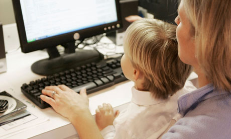 Mother and son at a computer