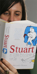 Woman reading Stuart: A Life Backwards by Alexander Masters