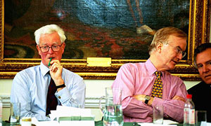 Hugo Young next to Douglas Hurd, talking to Peter Hain