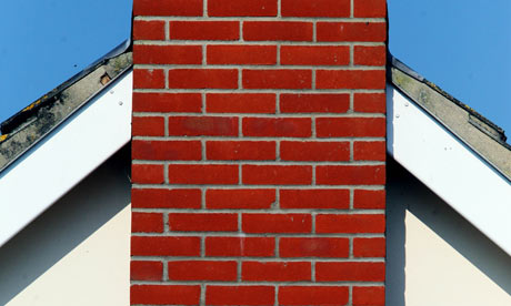 A house gable end with red brick chimney