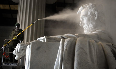 The statue of Abraham Lincoln is washed at the Lincoln memorial in Washington