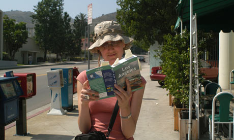 Tourist reads guidebook in LA