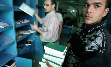 Clearing up after bombing of bookshop in Gaza City