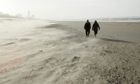 Walking on the beach during a sandstorm