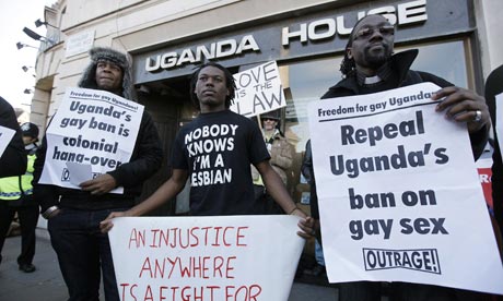 Demonstrators protest outside the Ugandan embassy in central London.
