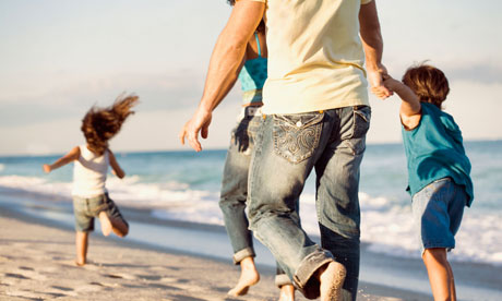 Family running on beach