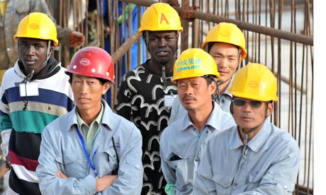 Seneglese and Chinese workers in dakar