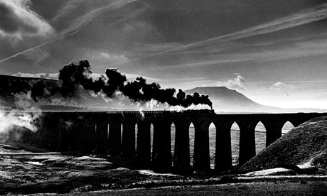 Steam-hauled train crosses the Ribblehead viaduct