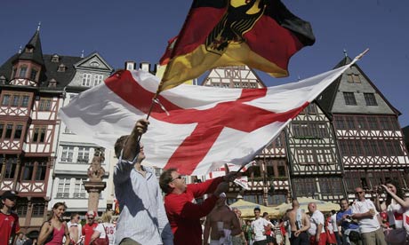 Soccer fans wave German and English flags in Frankfurt