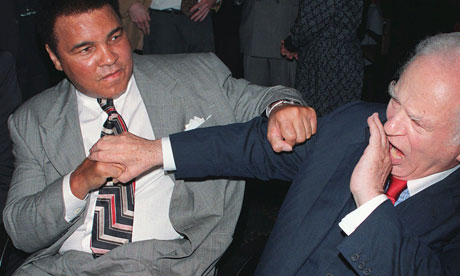 Muhammad Ali takes a swing at author Norman Mailer.