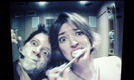 Josh Harris with his girlfriend Tonya seen through bathroom camera monitor