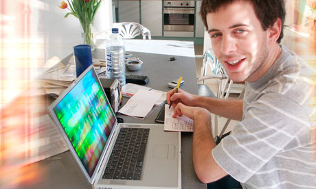 Teen writing at laptop