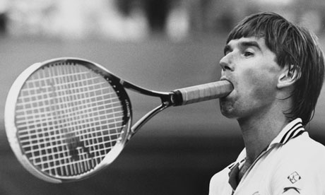 Jim Connors holding his tennis racquet in his mouth