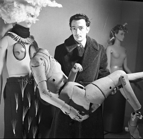 Salvador Dalí holding an artist’s lay figure, International Exhibition of Surrealism, Paris, 1938.