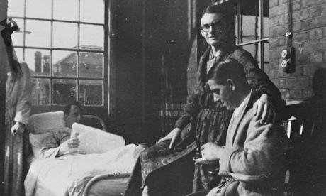 CK Scott Moncrieff (in spectacles) badly wounded in the leg, in Du Cane Road hospital in Hammersmith