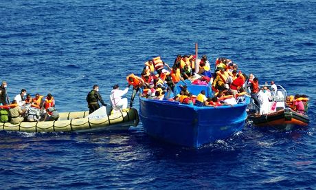 The Italian Navy help refugees in the Mediterranean in 2014. 