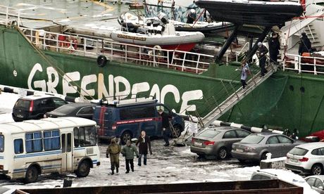 Rainbow checked … Arctic Sunrise's captain, Peter Willcox, is arrested and led from his ship in Murm