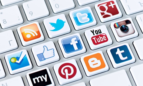 A social media logo collection of social network brand's placed on computer keyboard